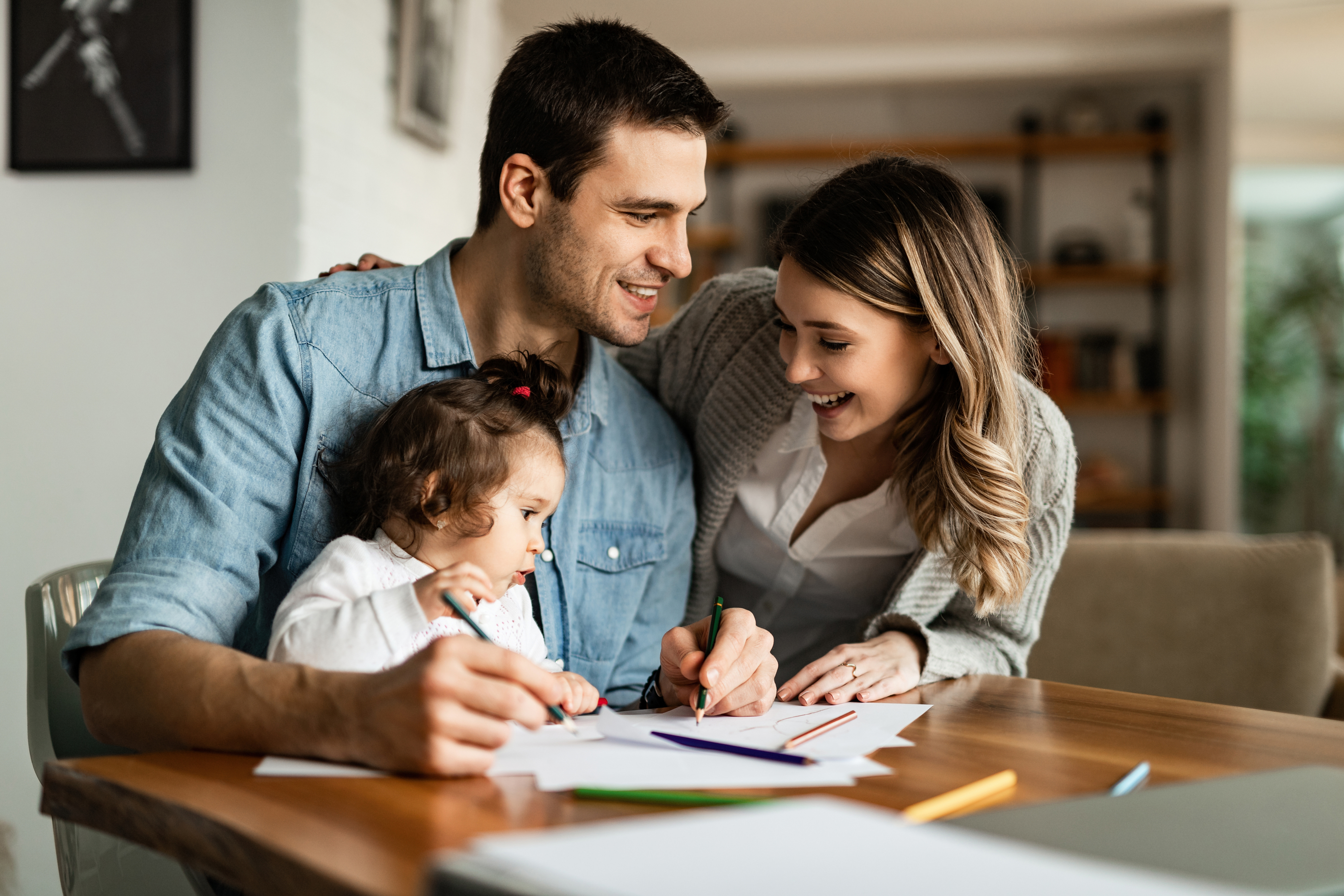 Happy family managing their finances with Gill Financial