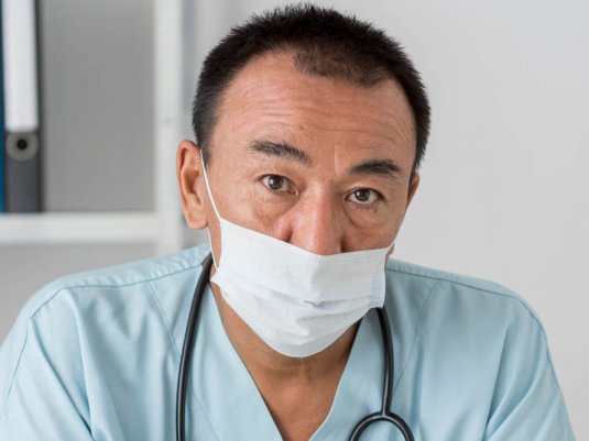 Filipino nurse helping family back home, supported by personal loans from Gill Financial Inc. Filipino male nurse supporting his family back home with financial assistance from Gill Financial Inc.